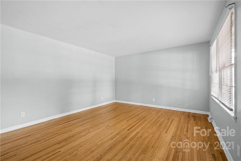 6833 Idlewild Road Charlotte, NC 28212 - Photo 8 of 24 wooden floor in a empty room