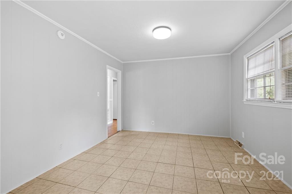 6833 Idlewild Road Charlotte, NC 28212 - Photo 10 of 24 an empty room with windows