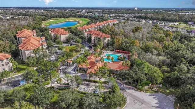 a view of a houses with swimming pool and a yard