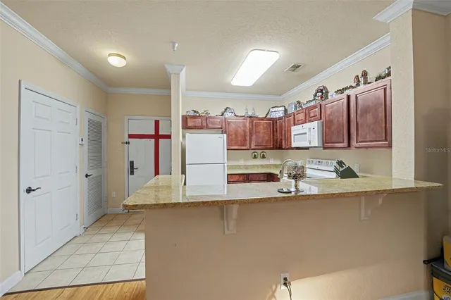 a spacious bathroom with a sink and a large mirror