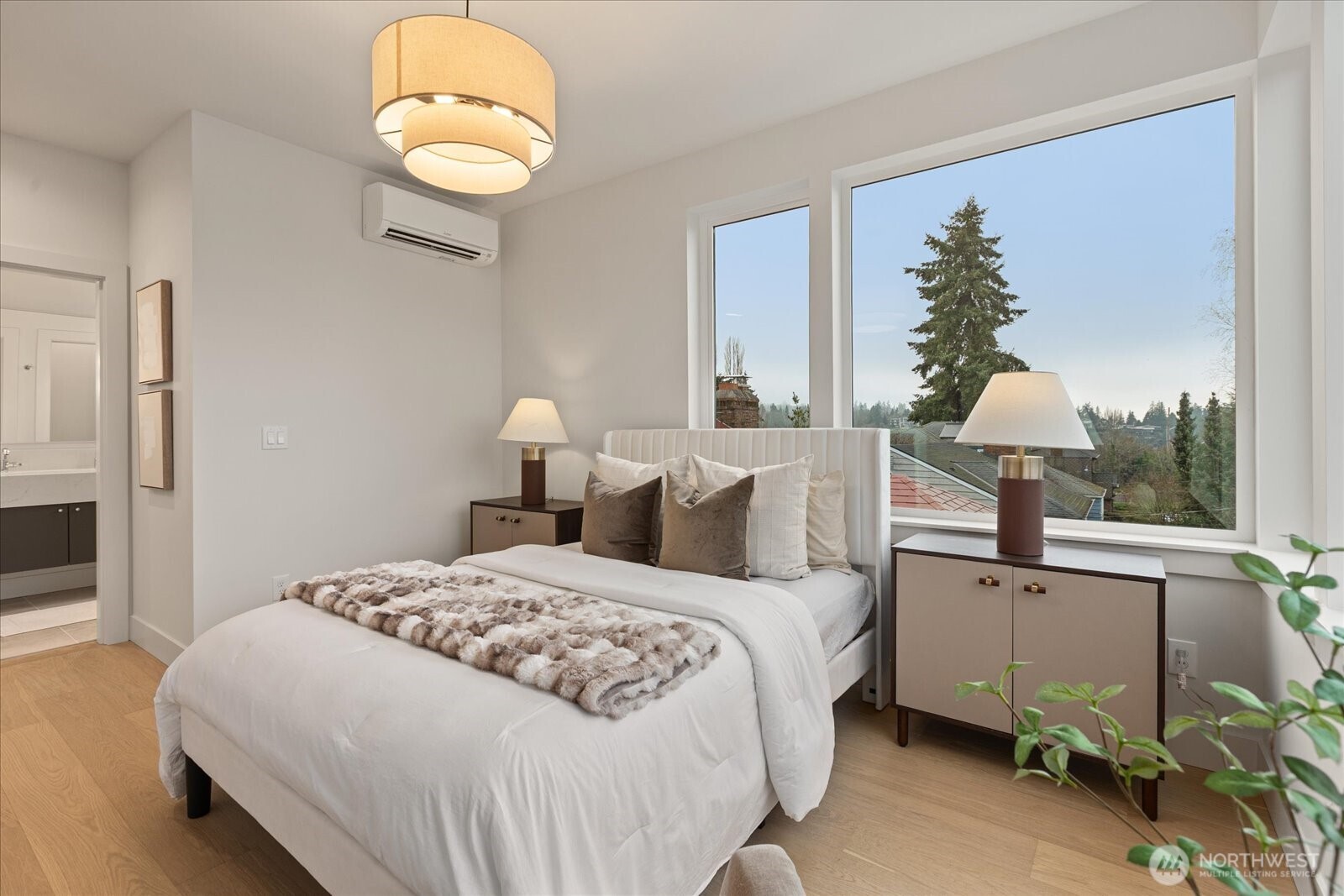 3409 Northwest 57th Street Seattle, WA 98107 - Photo 18 of 39 a bedroom with a bed and chandelier