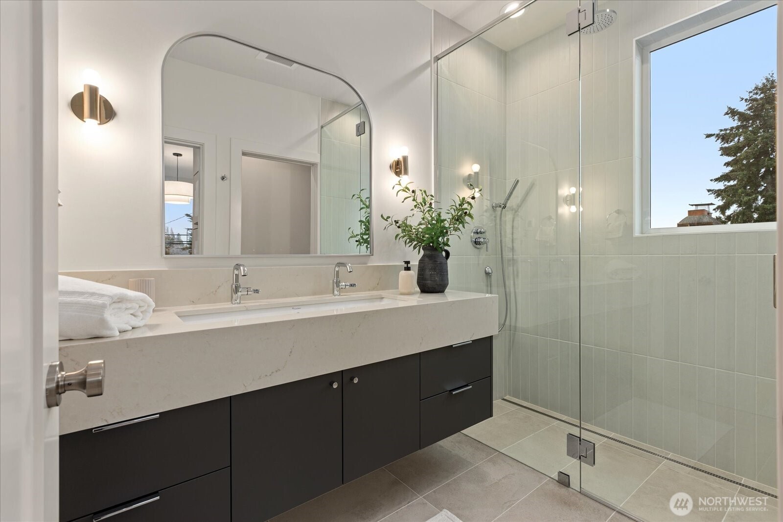 3409 Northwest 57th Street Seattle, WA 98107 - Photo 19 of 39 a bathroom with a double vanity sink and a mirror