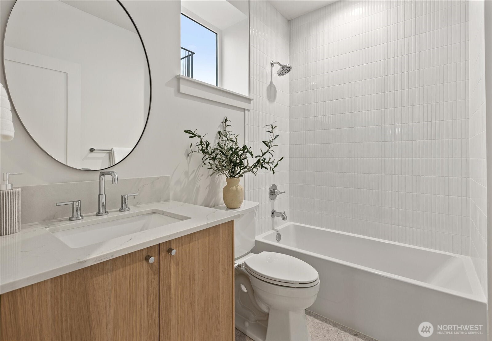 3409 Northwest 57th Street Seattle, WA 98107 - Photo 25 of 39 a bathroom with a sink a toilet and a mirror