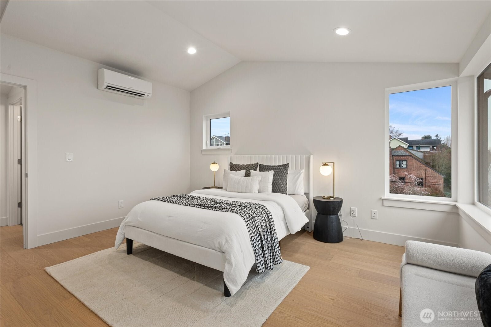 3409 Northwest 57th Street Seattle, WA 98107 - Photo 27 of 39 a spacious bedroom with a bed and a window