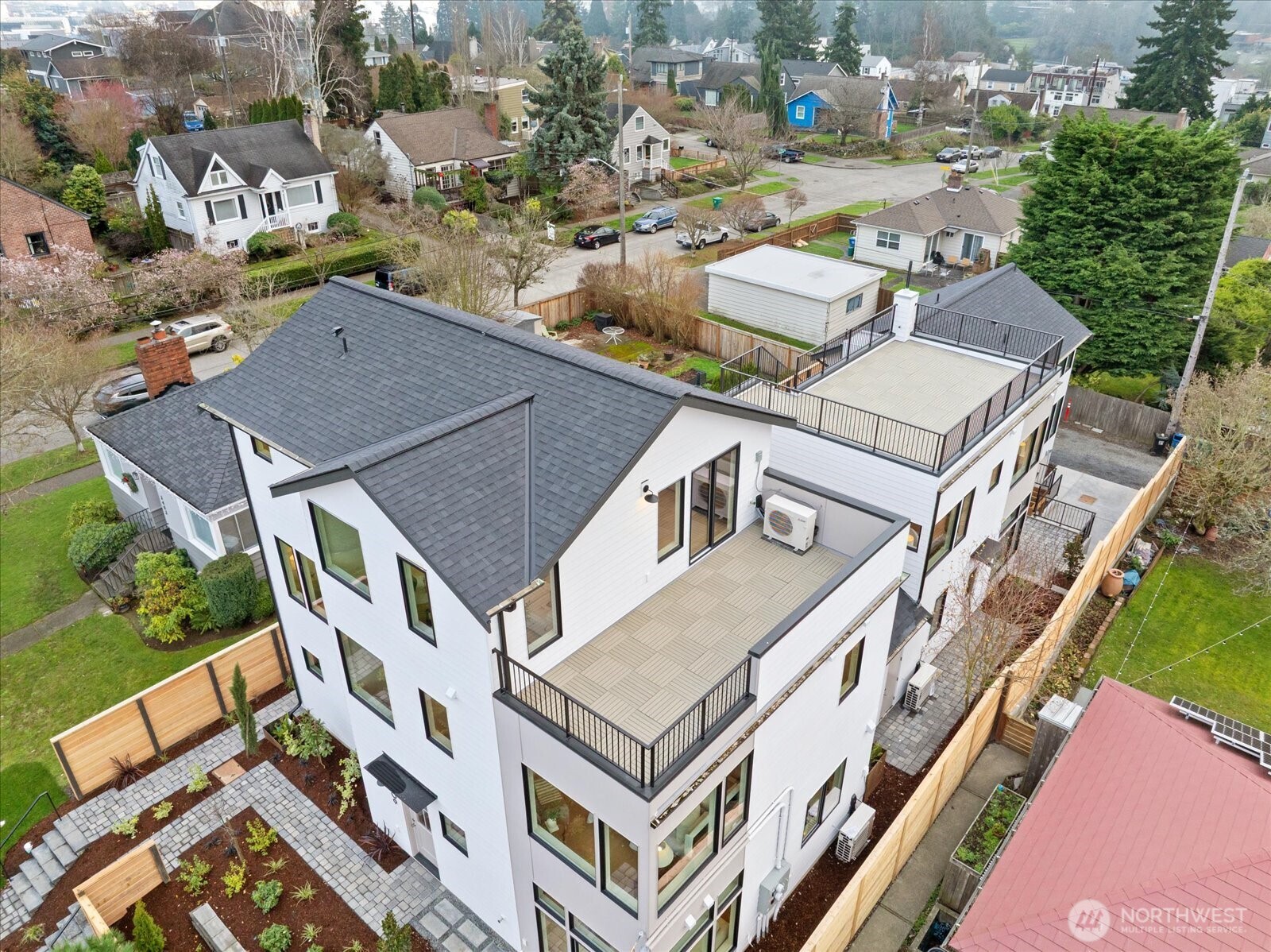 3409 Northwest 57th Street Seattle, WA 98107 - Photo 34 of 39 an aerial view of a residential apartment building with a yard