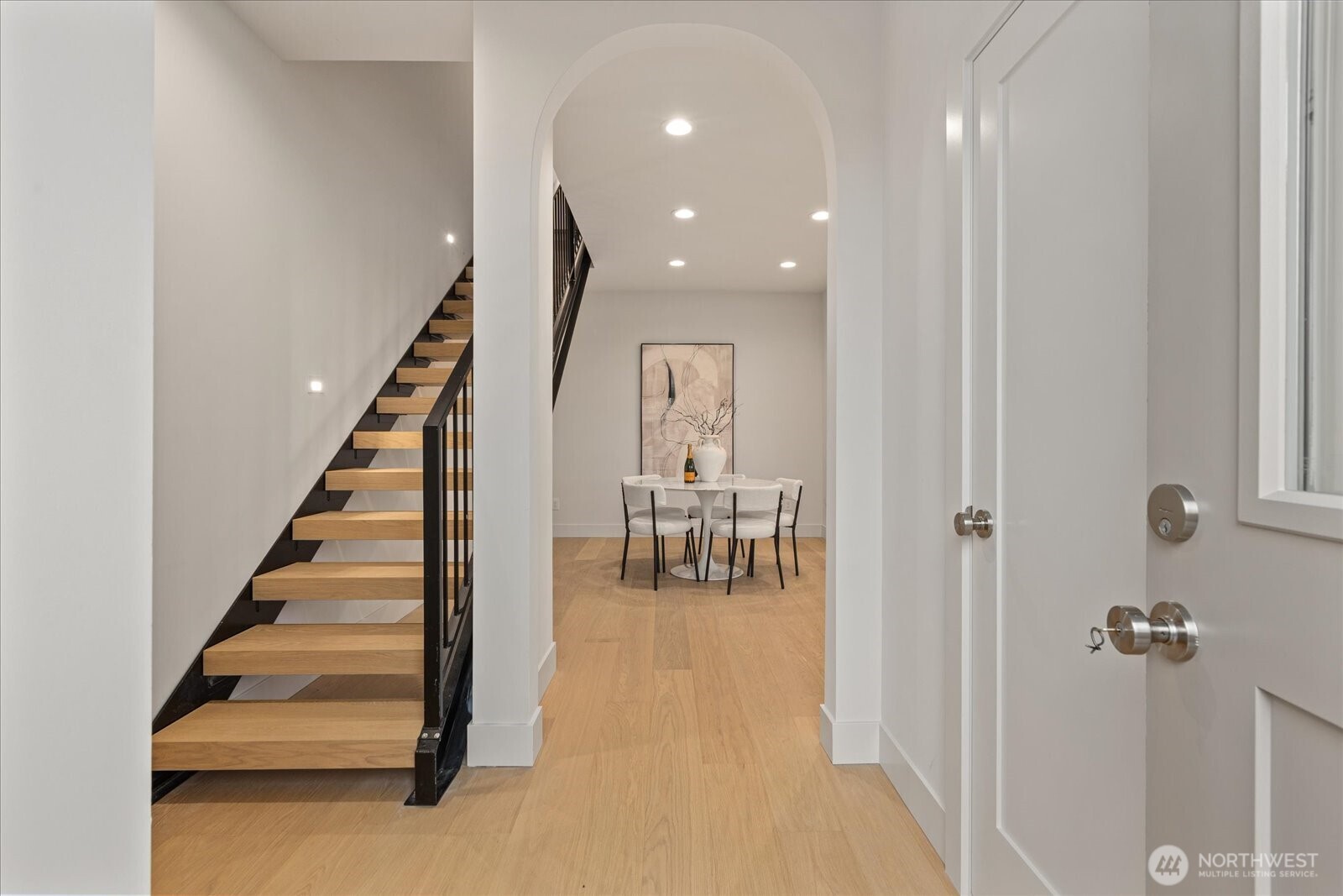 3409 Northwest 57th Street Seattle, WA 98107 - Photo 5 of 39 a view of entryway and hall with wooden floor