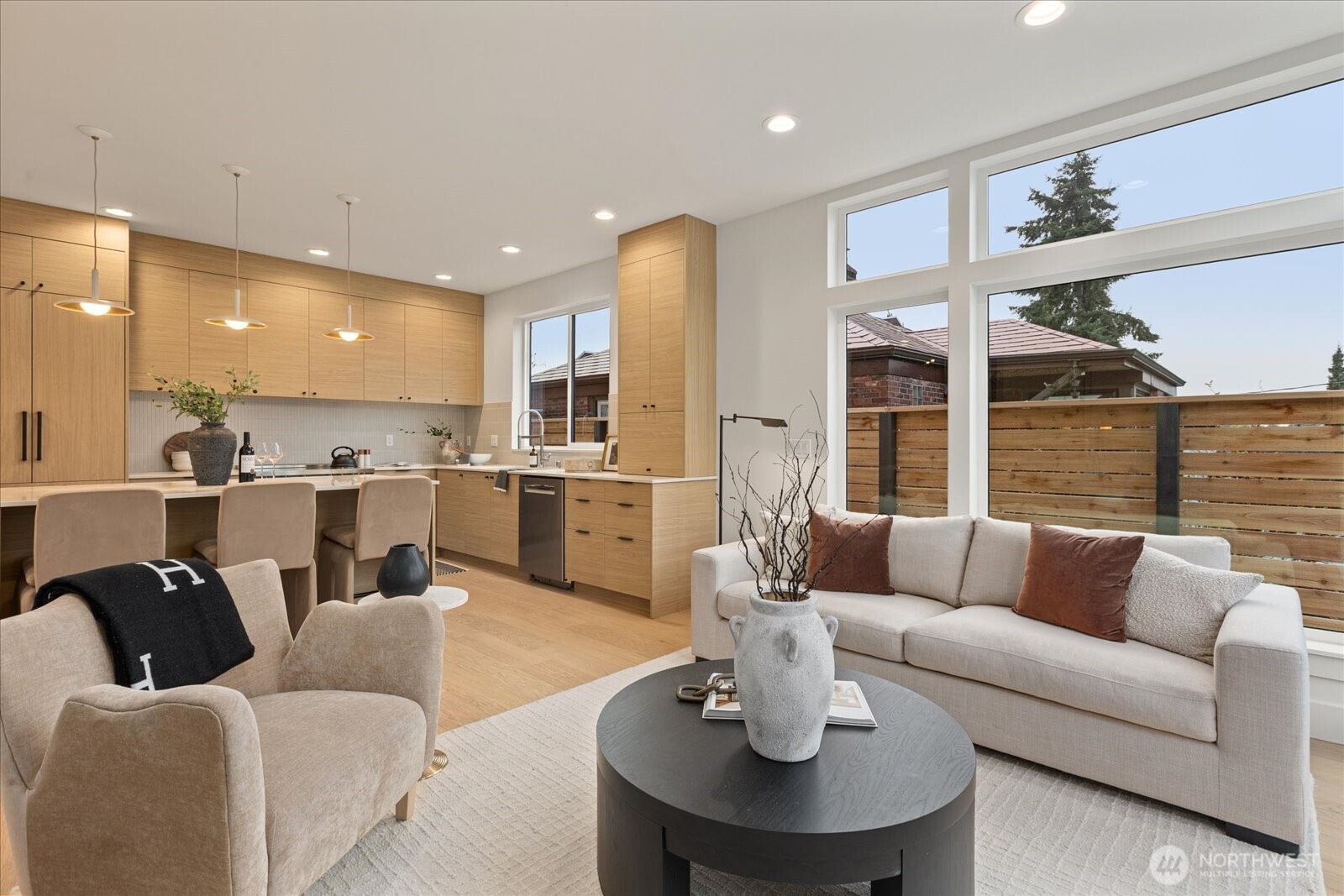 3409 Northwest 57th Street Seattle, WA 98107 - Photo 8 of 39 a living room with furniture kitchen view and a large window