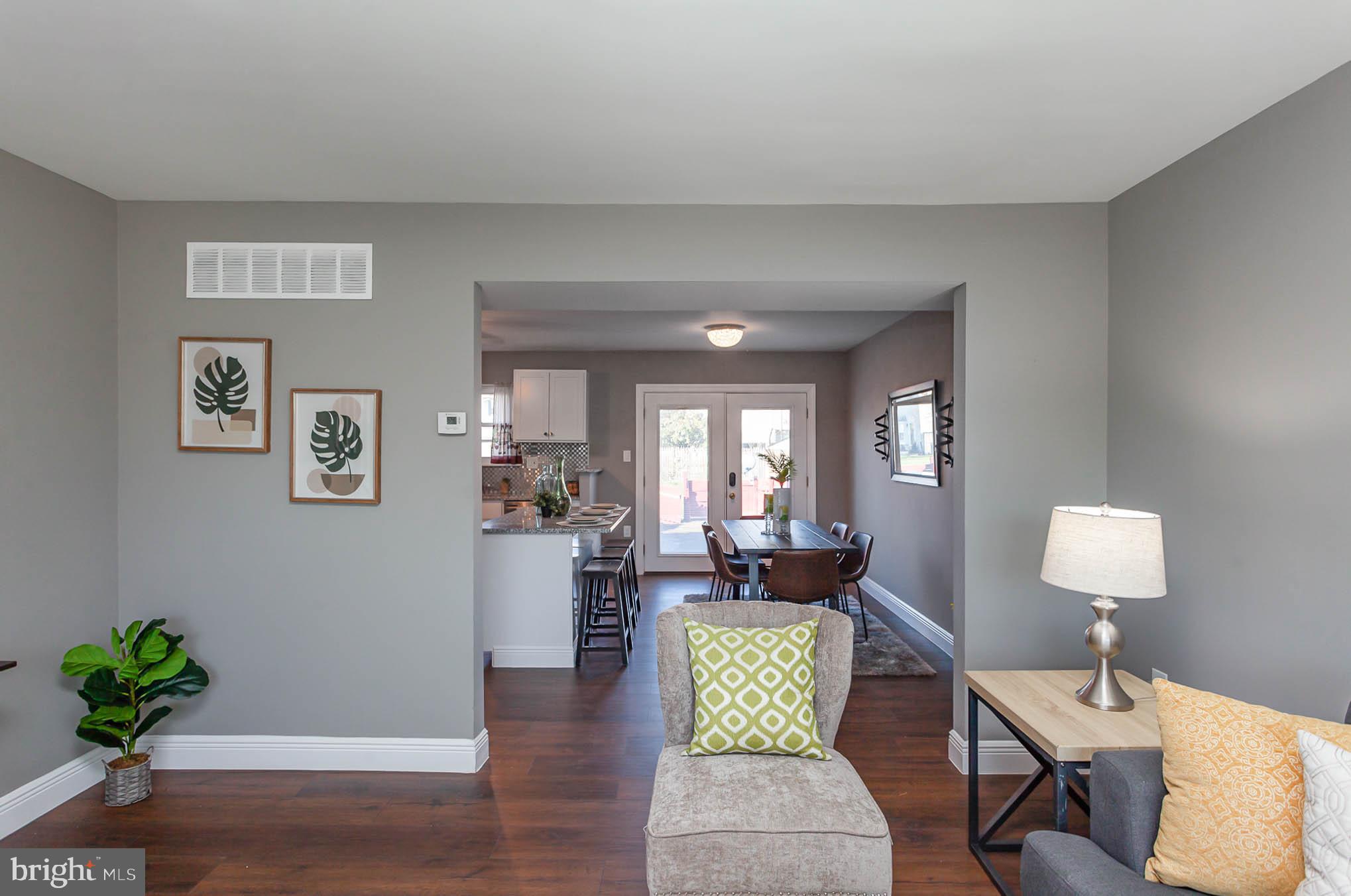 9662 Baron Place, Unit 9662 Rosedale, MD 21237 - Photo 6 of 35 Living Room Open to Dining Area