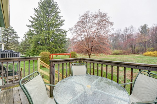 43 Robert Road Stow, MA 01775 - Photo 14 of 22 a view of a balcony with wooden floor and fence
