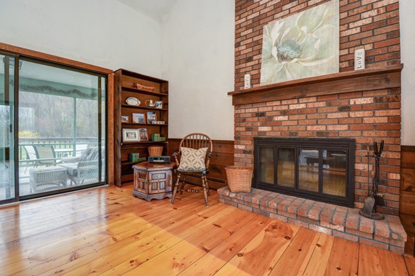 43 Robert Road Stow, MA 01775 - Photo 10 of 22 a living room with furniture and a fireplace