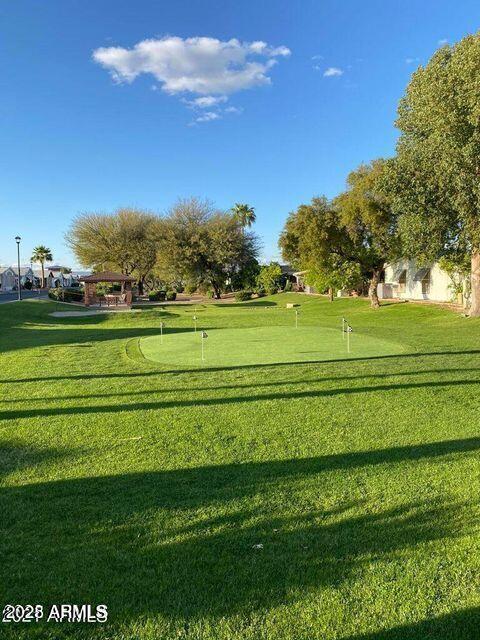 5735 East McDowell Road, Unit 63 Mesa, AZ 85215 - Photo 13 of 27 a view of a big and grassy field with trees