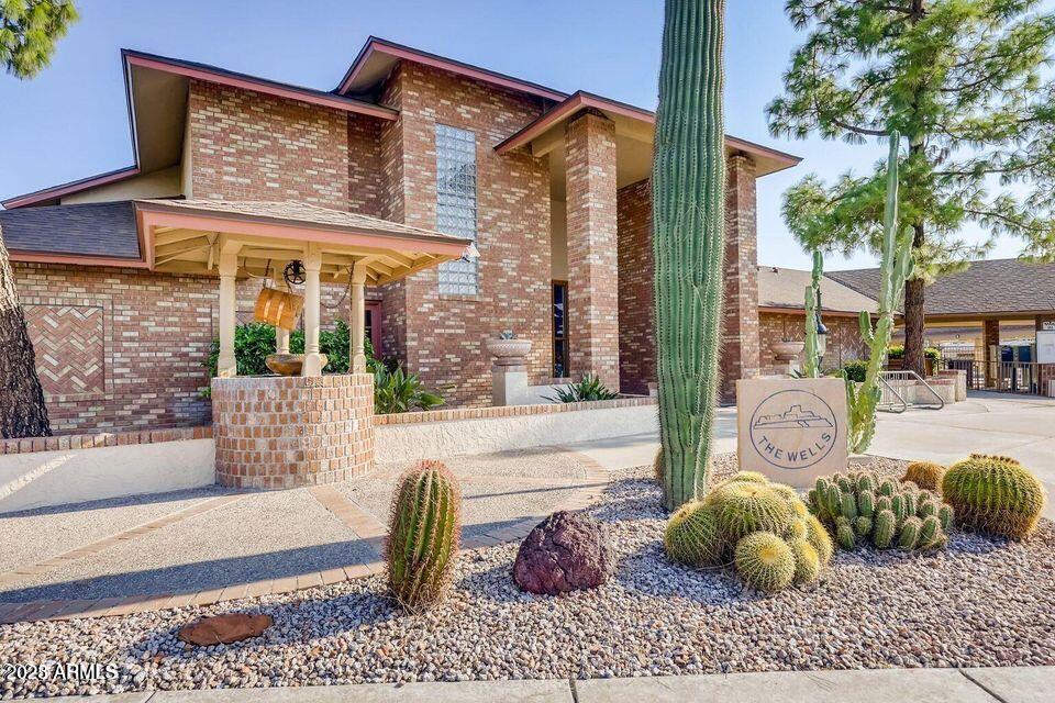 5735 East McDowell Road, Unit 63 Mesa, AZ 85215 - Photo 15 of 27 a front view of a house with outdoor seating