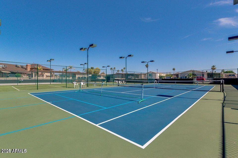 5735 East McDowell Road, Unit 63 Mesa, AZ 85215 - Photo 24 of 27 a view of a tennis court