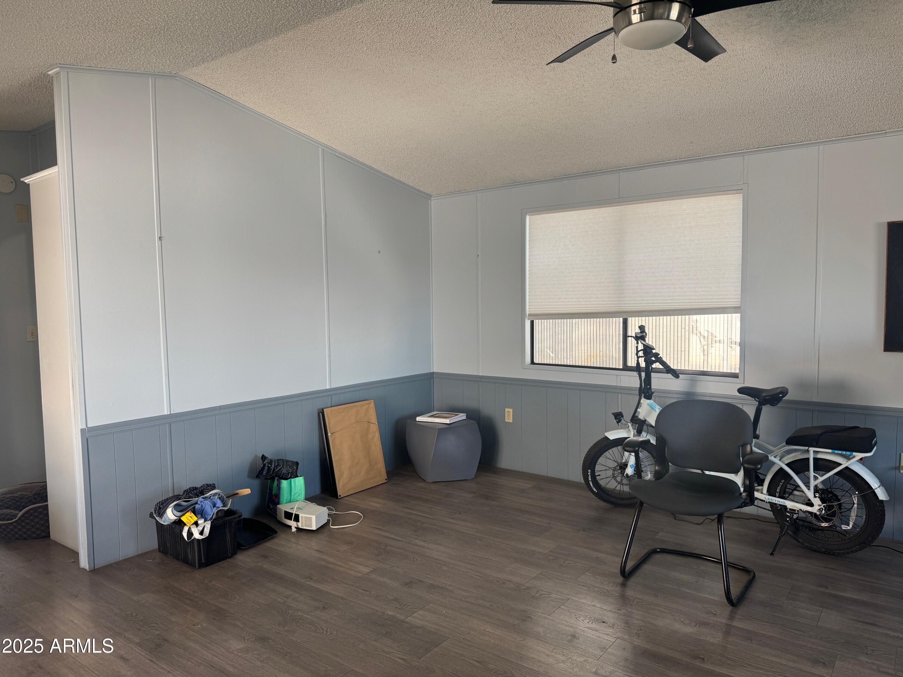 5735 East McDowell Road, Unit 63 Mesa, AZ 85215 - Photo 3 of 27 a living room with furniture and a window