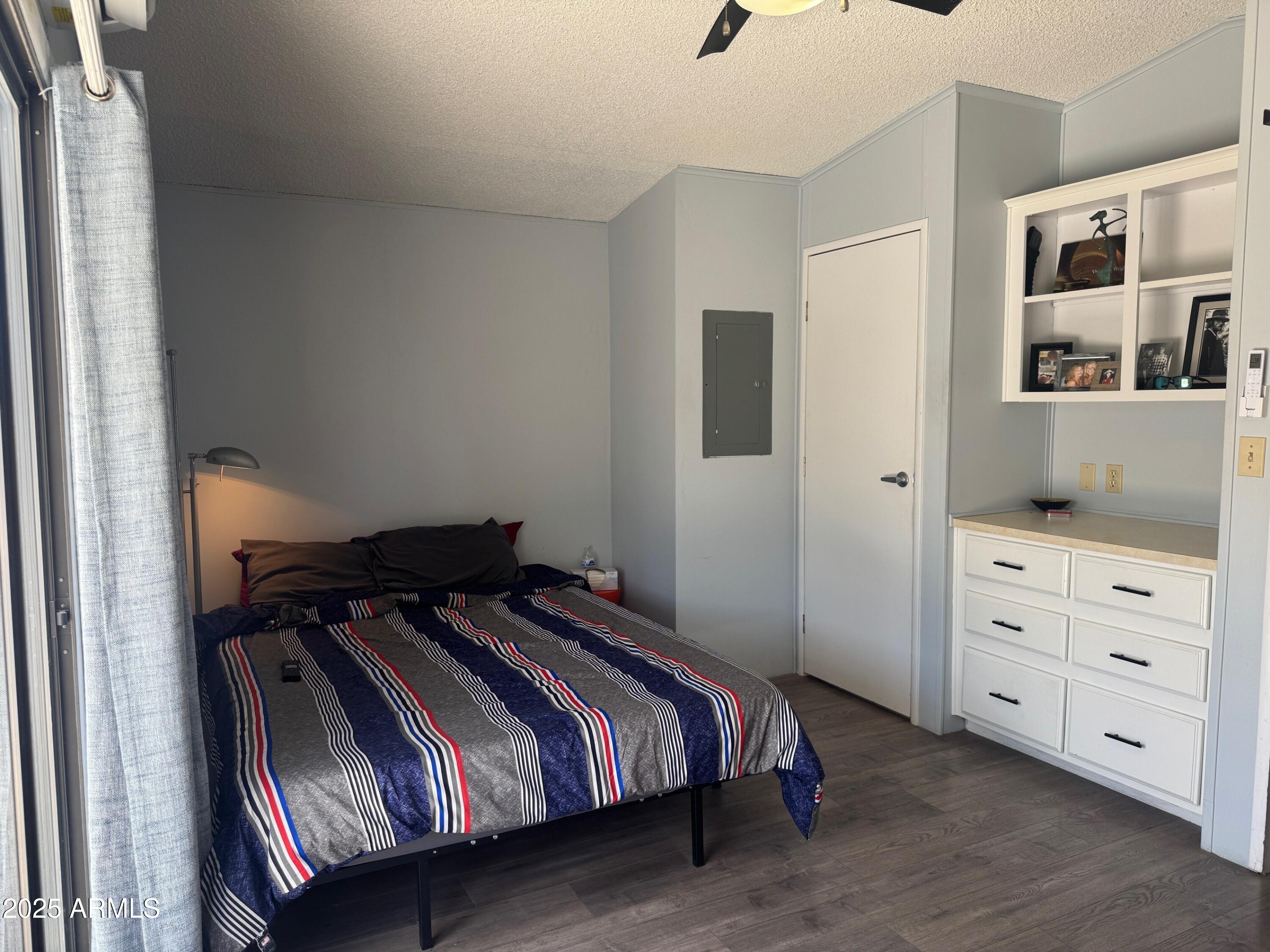 5735 East McDowell Road, Unit 63 Mesa, AZ 85215 - Photo 4 of 27 a bedroom with a bed and closet