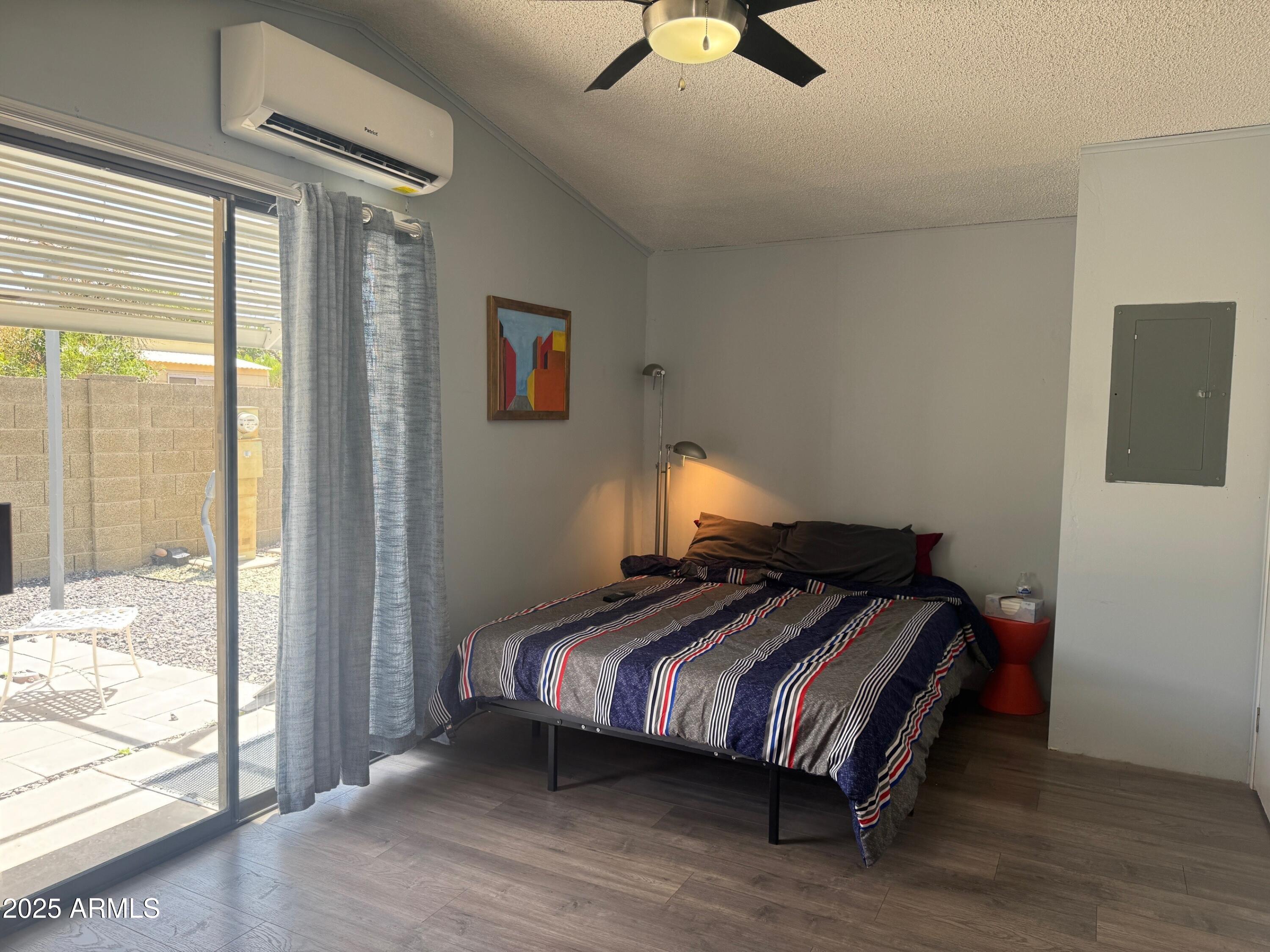 5735 East McDowell Road, Unit 63 Mesa, AZ 85215 - Photo 5 of 27 a bedroom with bed and window