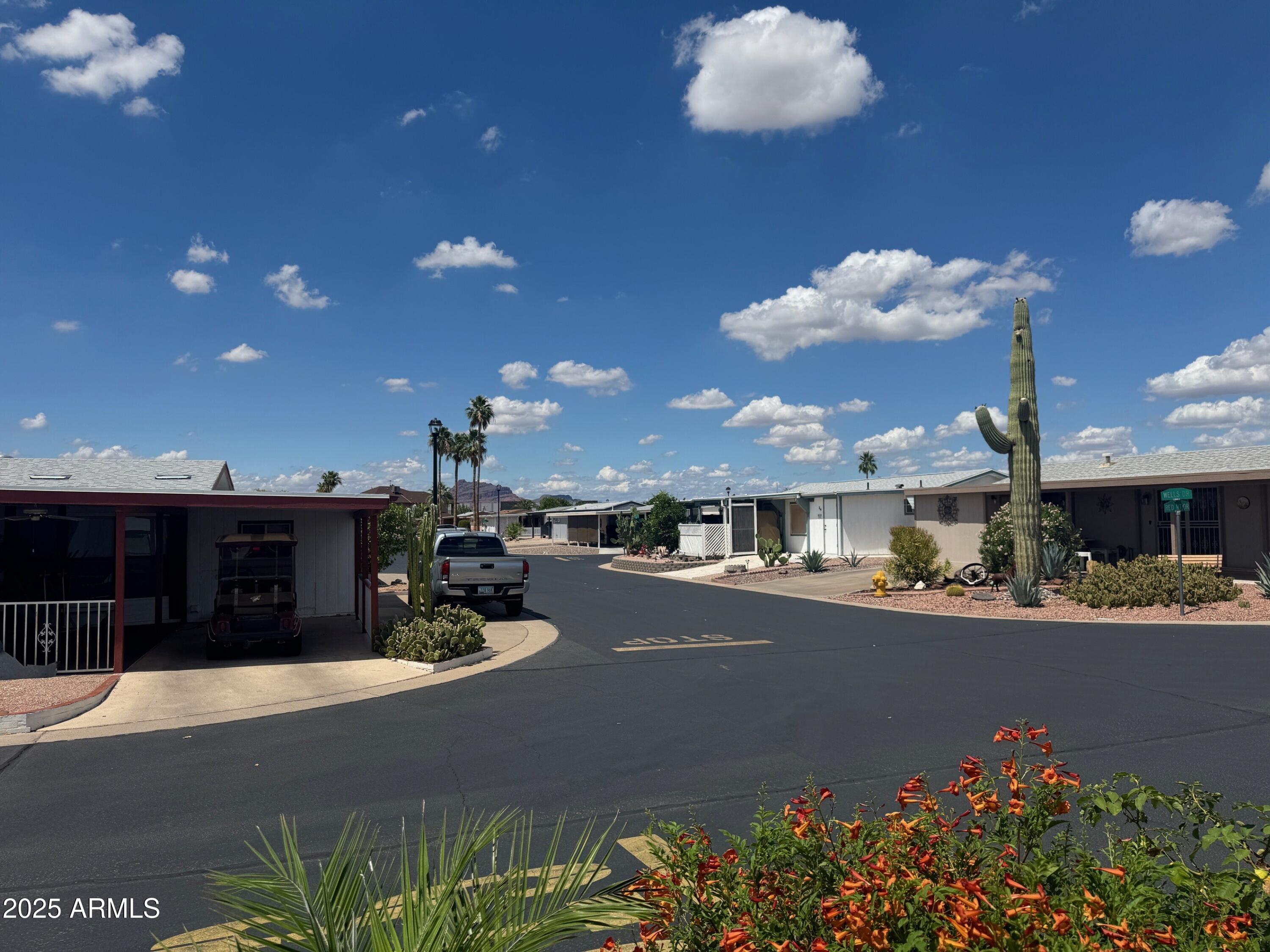 5735 East McDowell Road, Unit 63 Mesa, AZ 85215 - Photo 10 of 27 a kitchen with a sink and chandelier