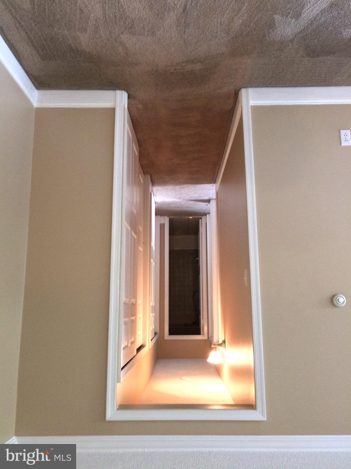 250 Ridge Pike, Unit CONDO 349 Lafayette Hill, PA 19444 - Photo 20 of 21 Illuminated hallway with inviting depth.