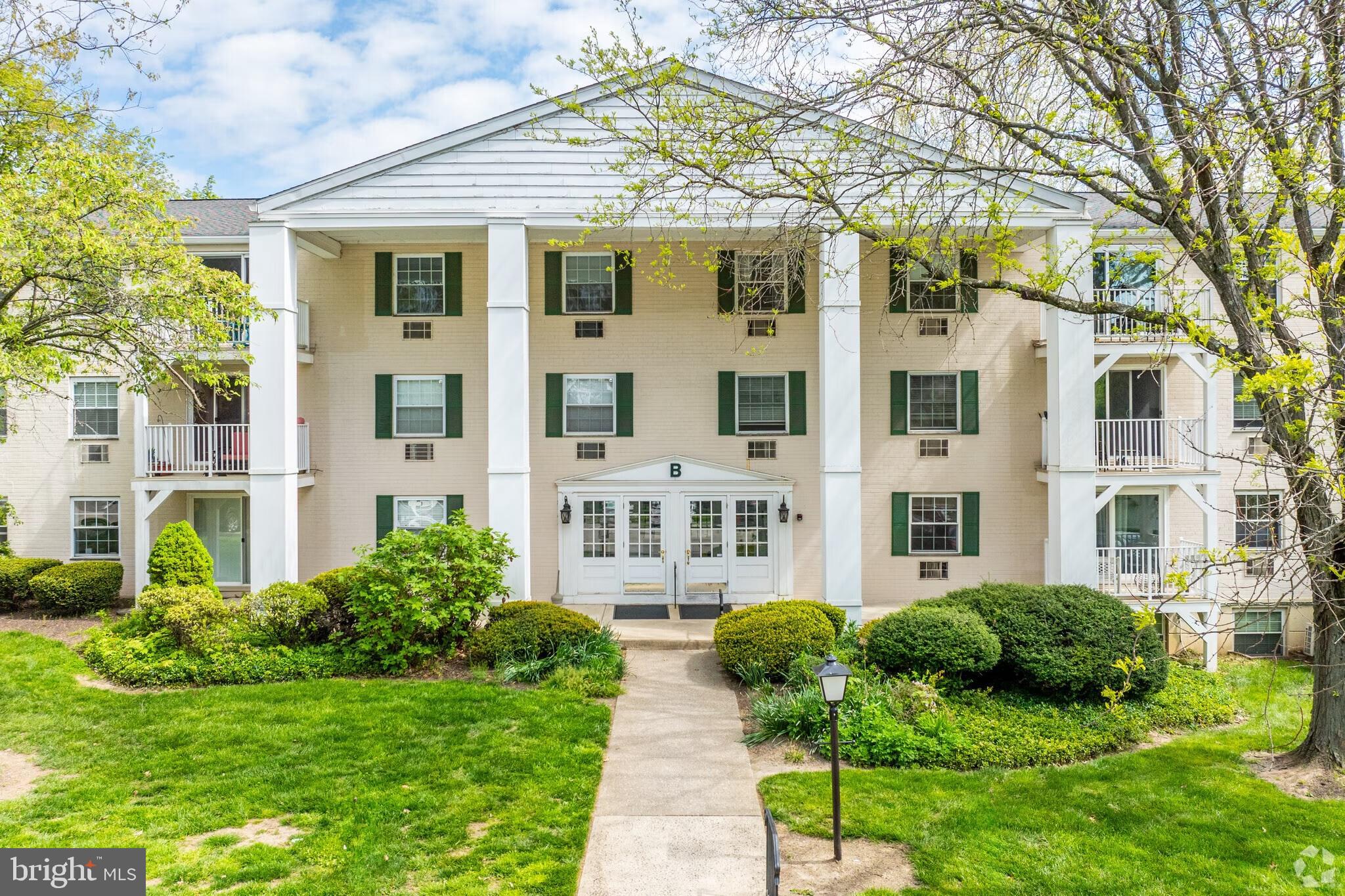 250 Ridge Pike, Unit CONDO 349 Lafayette Hill, PA 19444 - Photo 2 of 21 Charming residence with lush greenery.