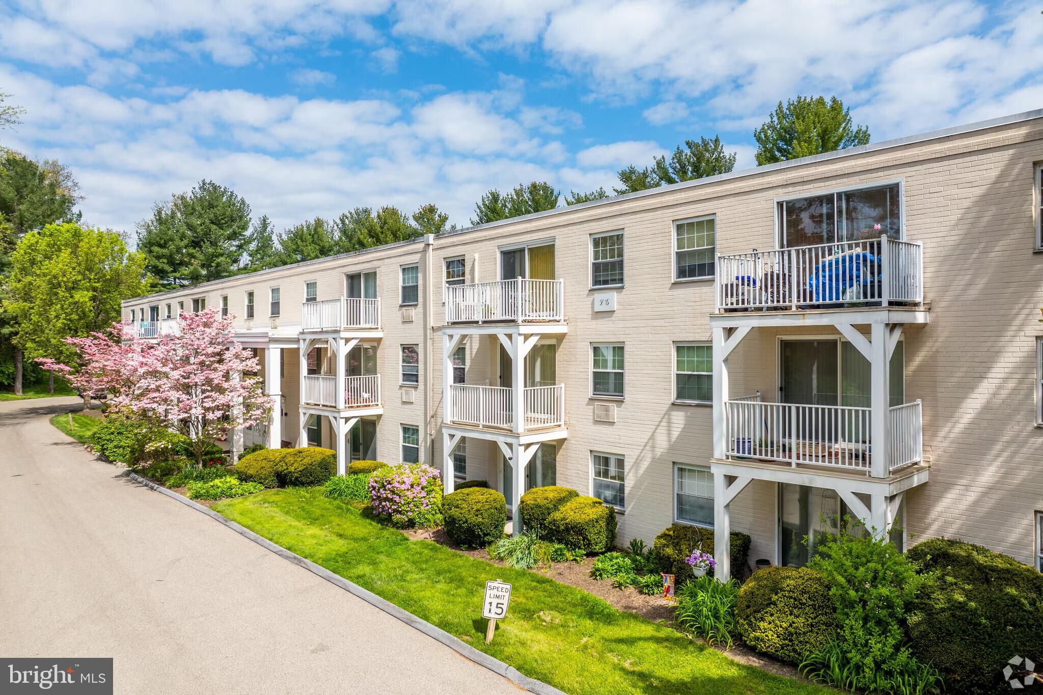 250 Ridge Pike, Unit CONDO 349 Lafayette Hill, PA 19444 - Photo 4 of 21 Charming apartments amidst blooming greenery.