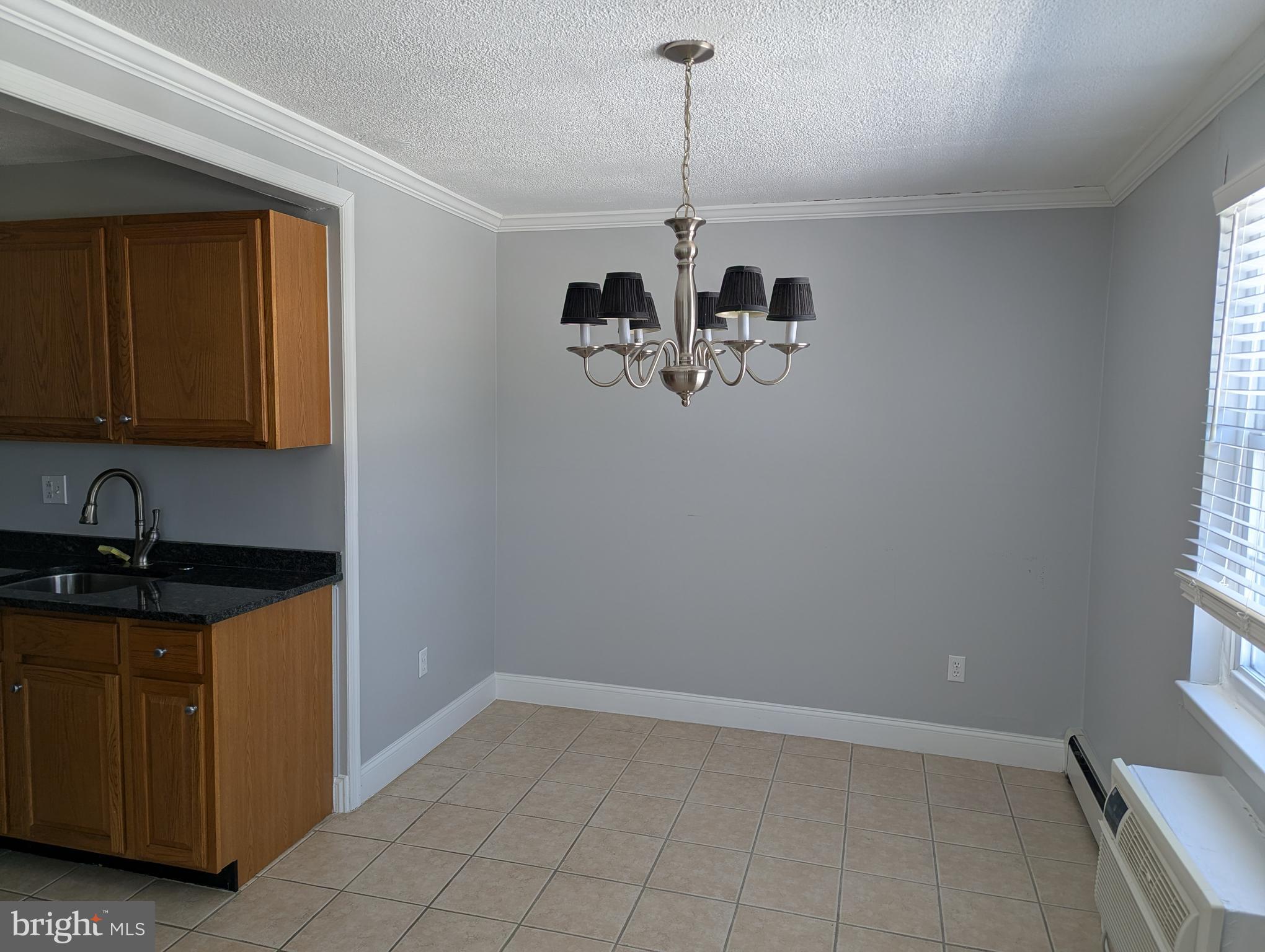 250 Ridge Pike, Unit CONDO 349 Lafayette Hill, PA 19444 - Photo 8 of 16 a kitchen with a refrigerator and cabinets