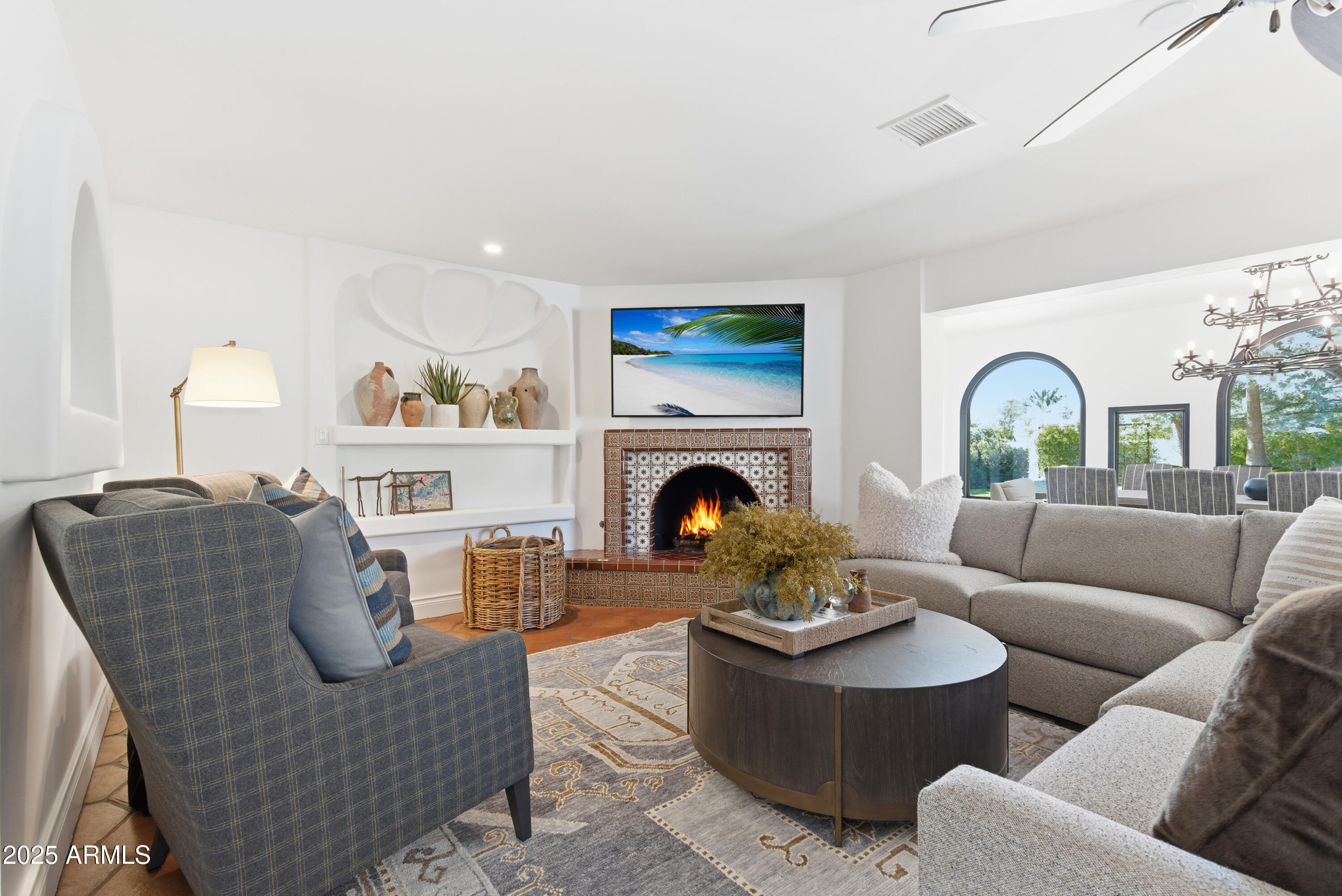 5828 East Cactus Wren Road Paradise Valley, AZ 85253 - Photo 12 of 44 a living room with furniture and a fireplace