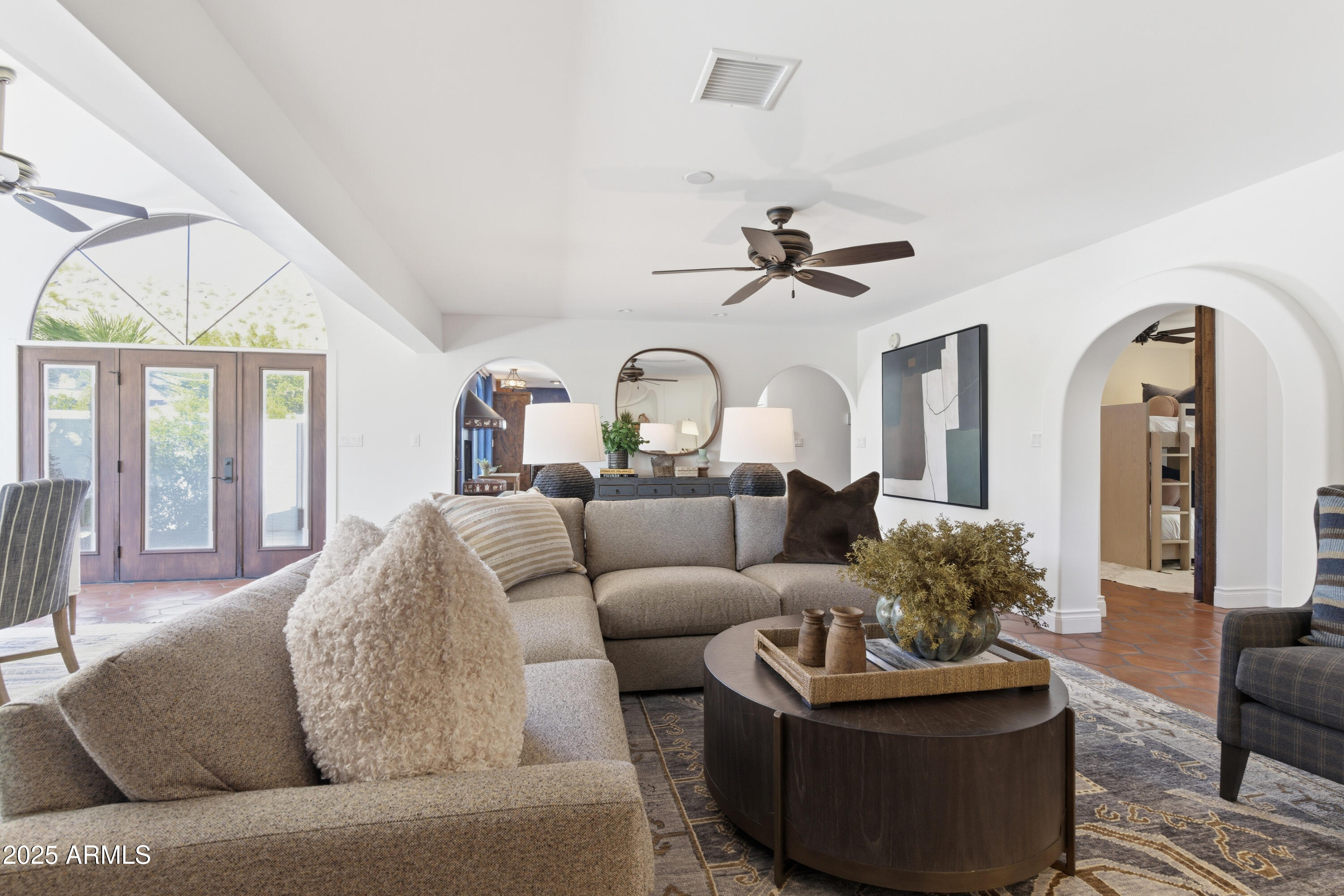 5828 East Cactus Wren Road Paradise Valley, AZ 85253 - Photo 15 of 44 a living room with furniture a ceiling fan and a large window