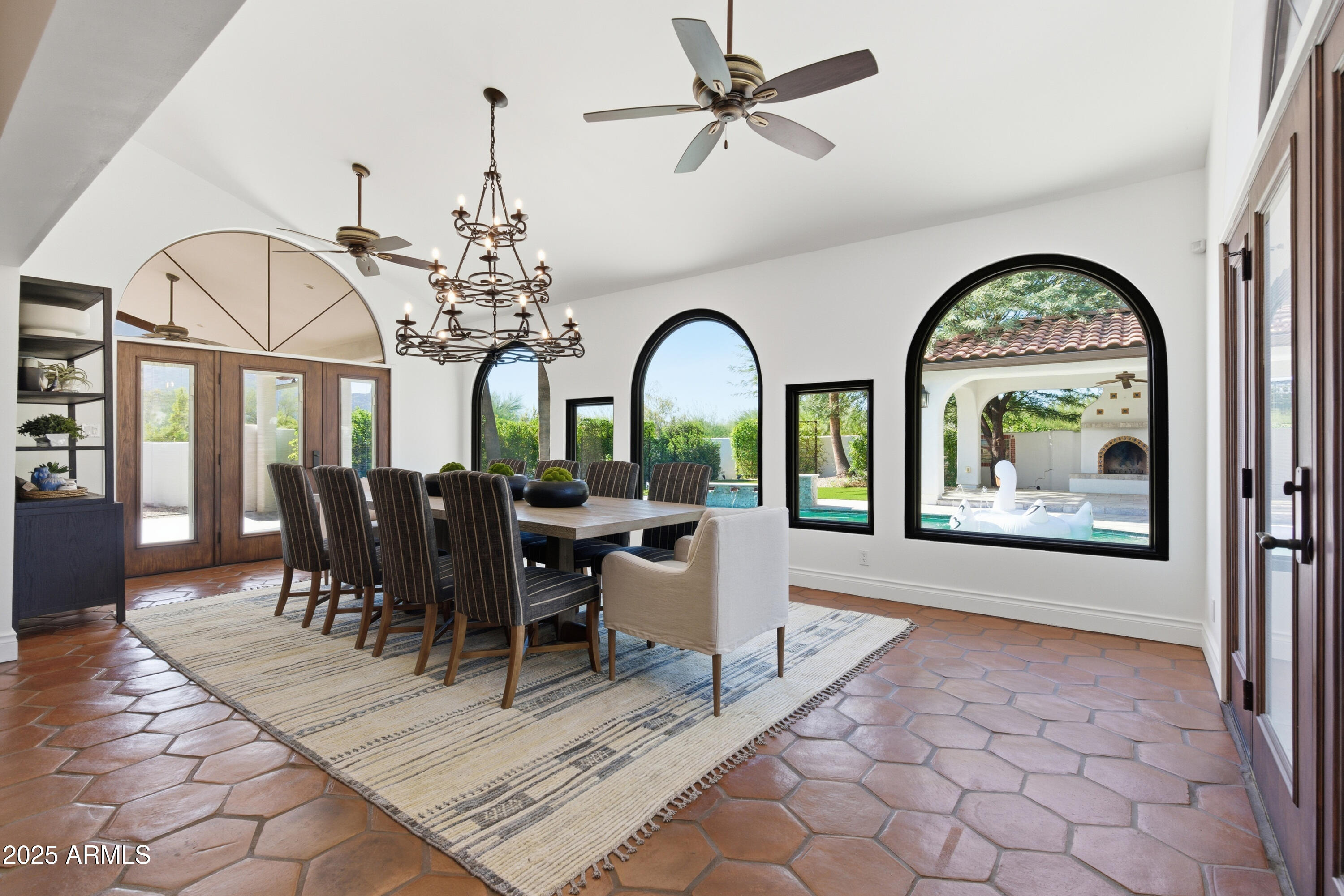 5828 East Cactus Wren Road Paradise Valley, AZ 85253 - Photo 16 of 44 a view of a dining room with furniture window and wooden floor