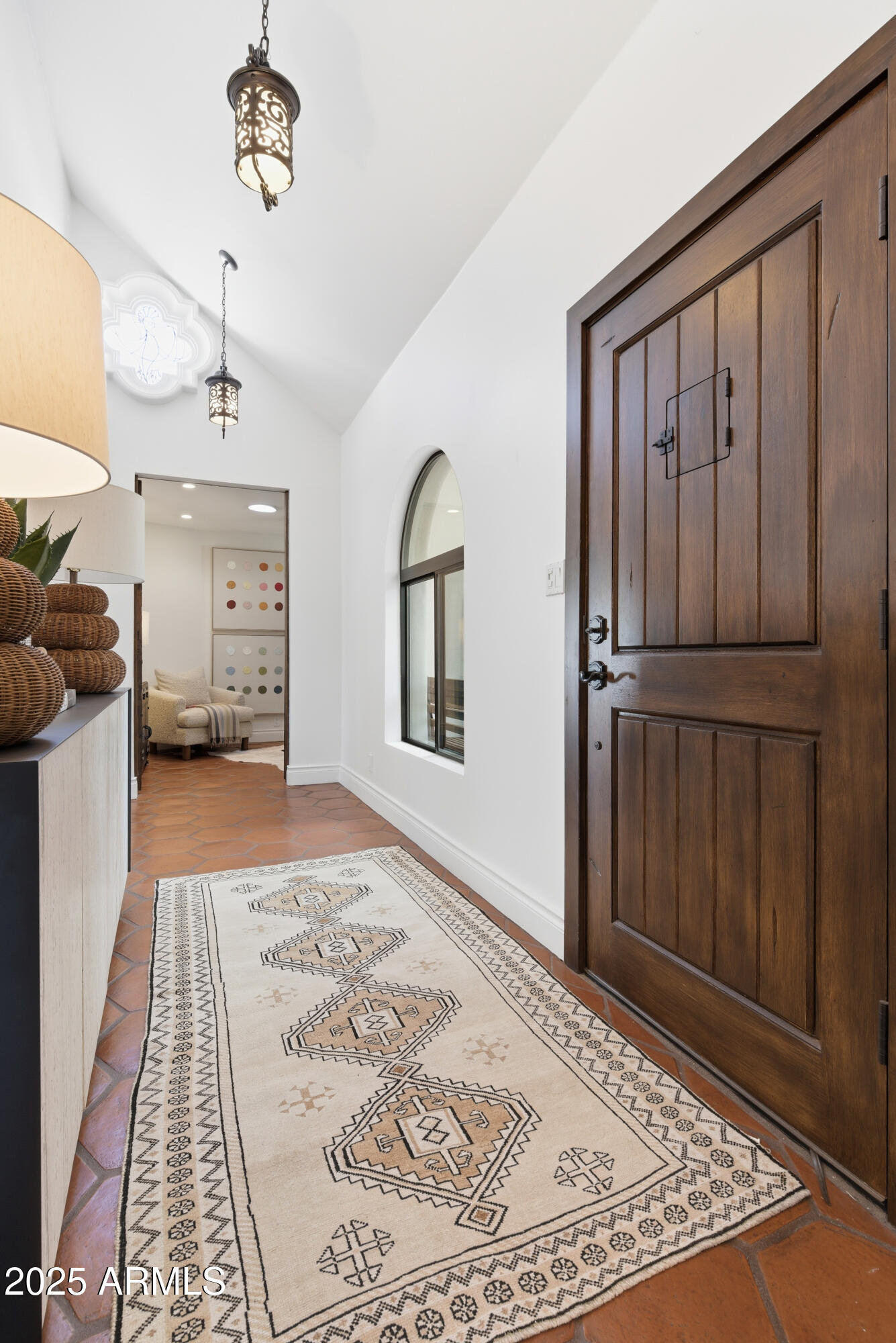 5828 East Cactus Wren Road Paradise Valley, AZ 85253 - Photo 20 of 44 a view of a bedroom with wooden floor and a ceiling fan