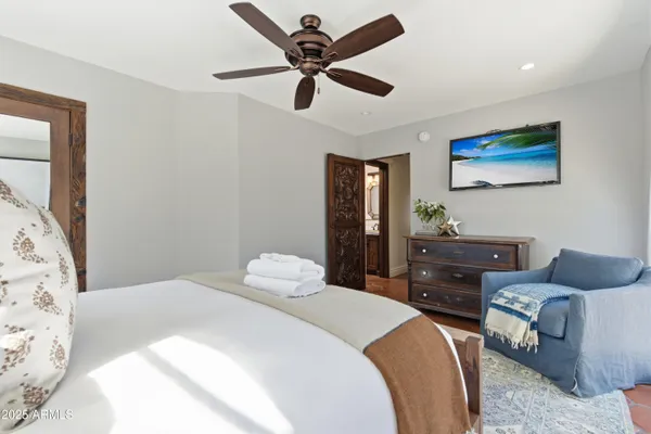 a bedroom with a bed dresser and a window