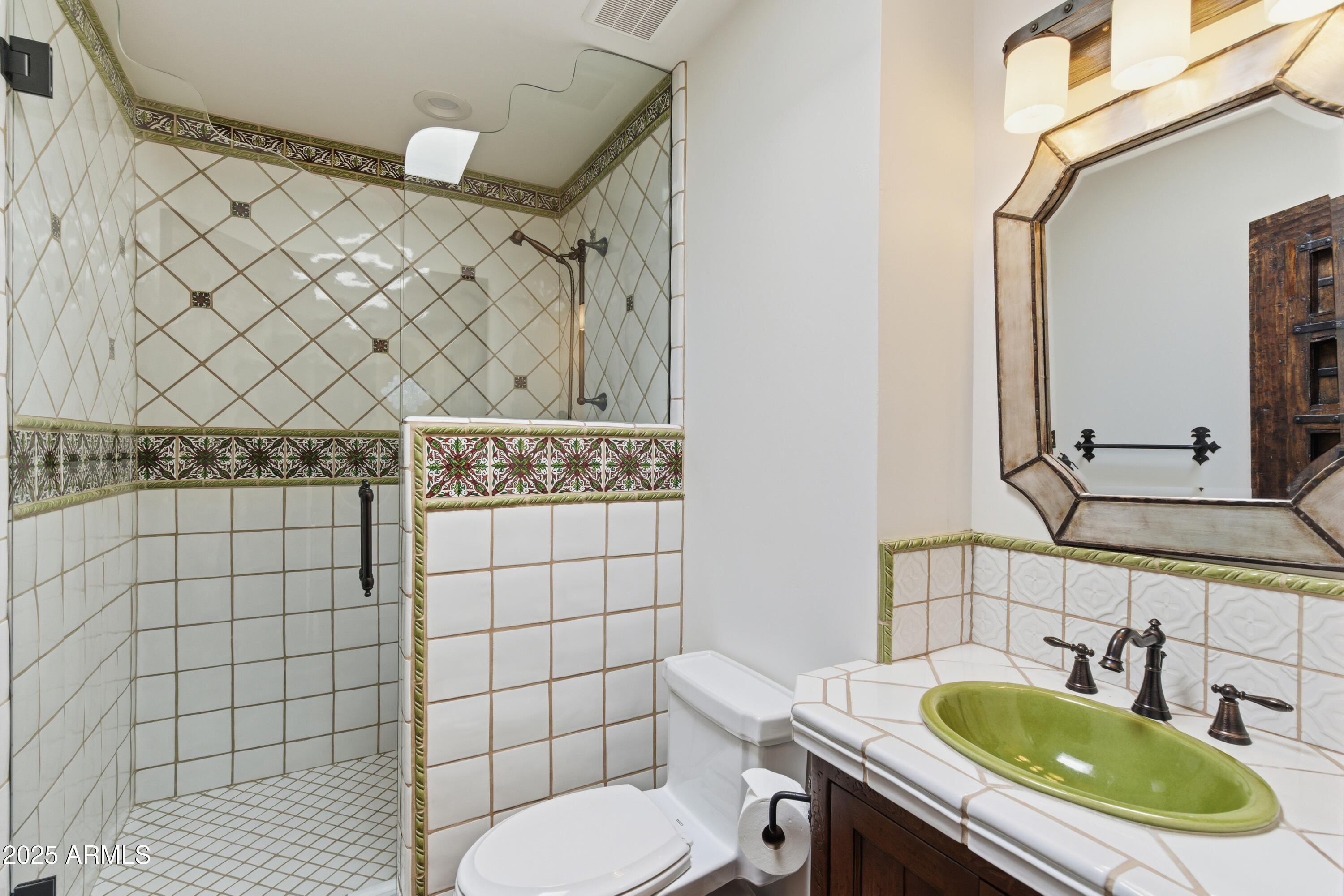 5828 East Cactus Wren Road Paradise Valley, AZ 85253 - Photo 29 of 44 a bathroom with a sink a toilet and mirror