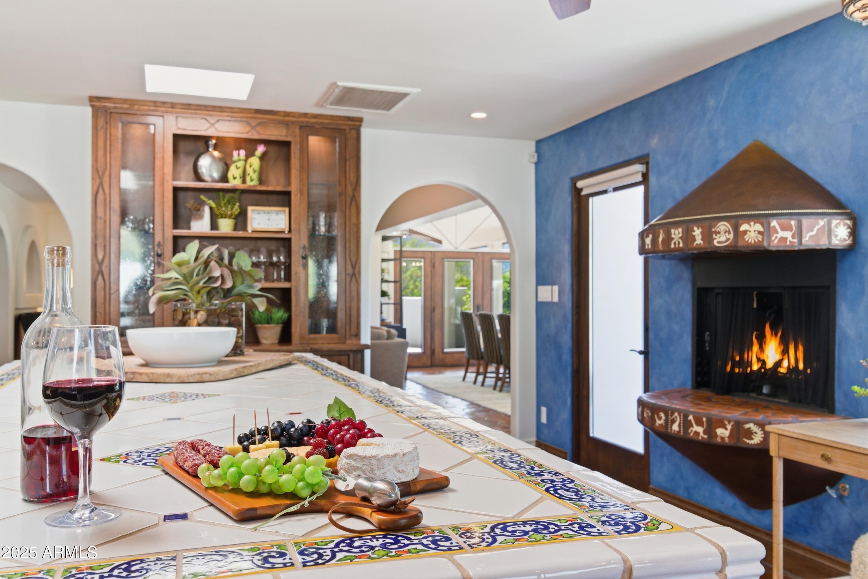 5828 East Cactus Wren Road Paradise Valley, AZ 85253 - Photo 4 of 44 a spacious bedroom with a bed and a chandelier