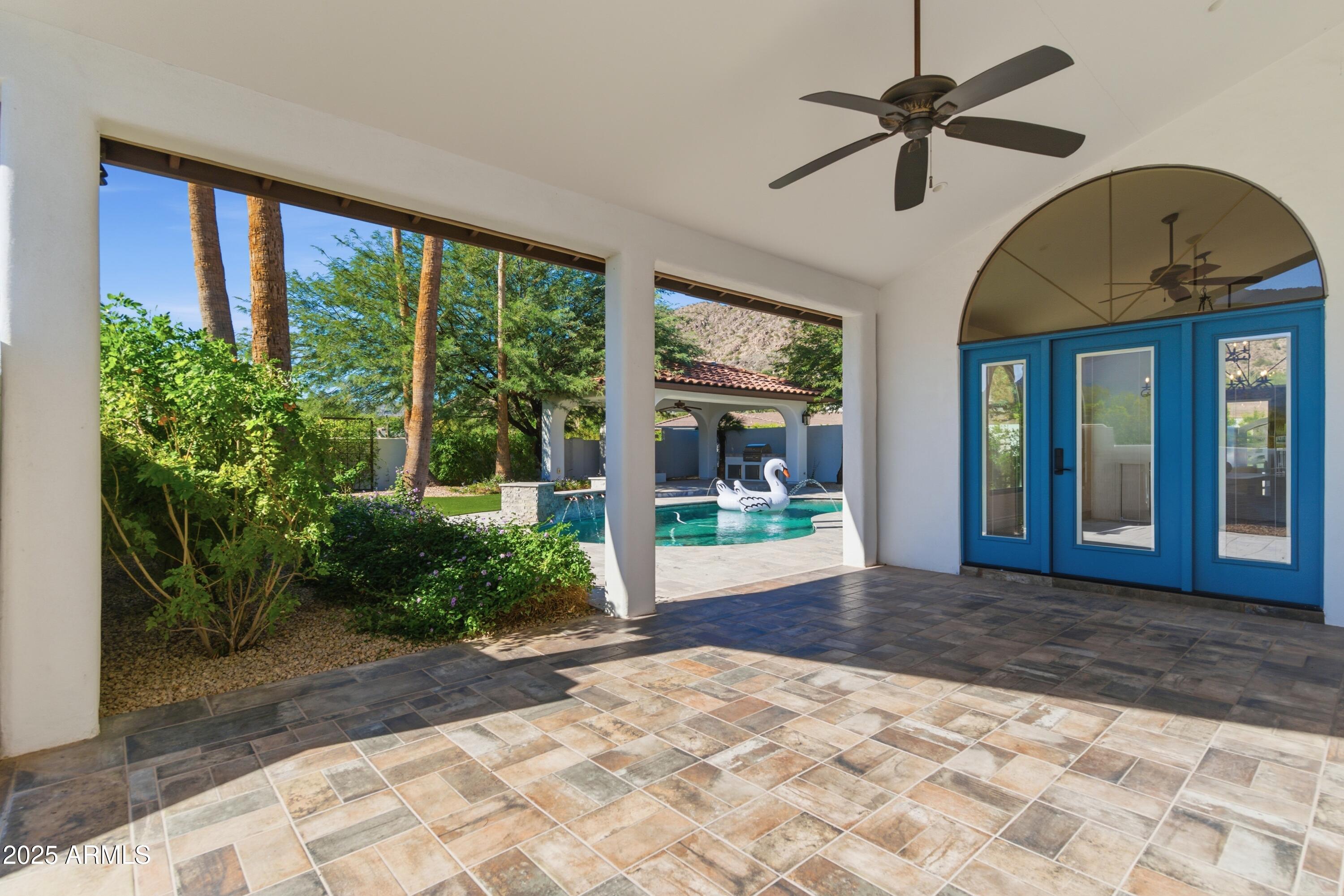 5828 East Cactus Wren Road Paradise Valley, AZ 85253 - Photo 43 of 44 a view of entrance gate with a ceiling fan and window