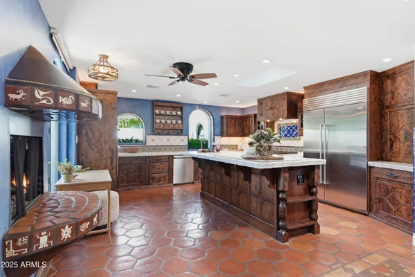a kitchen with a sink appliances and cabinets