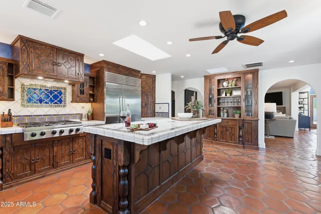 a kitchen with stainless steel appliances granite countertop lots of counter top space