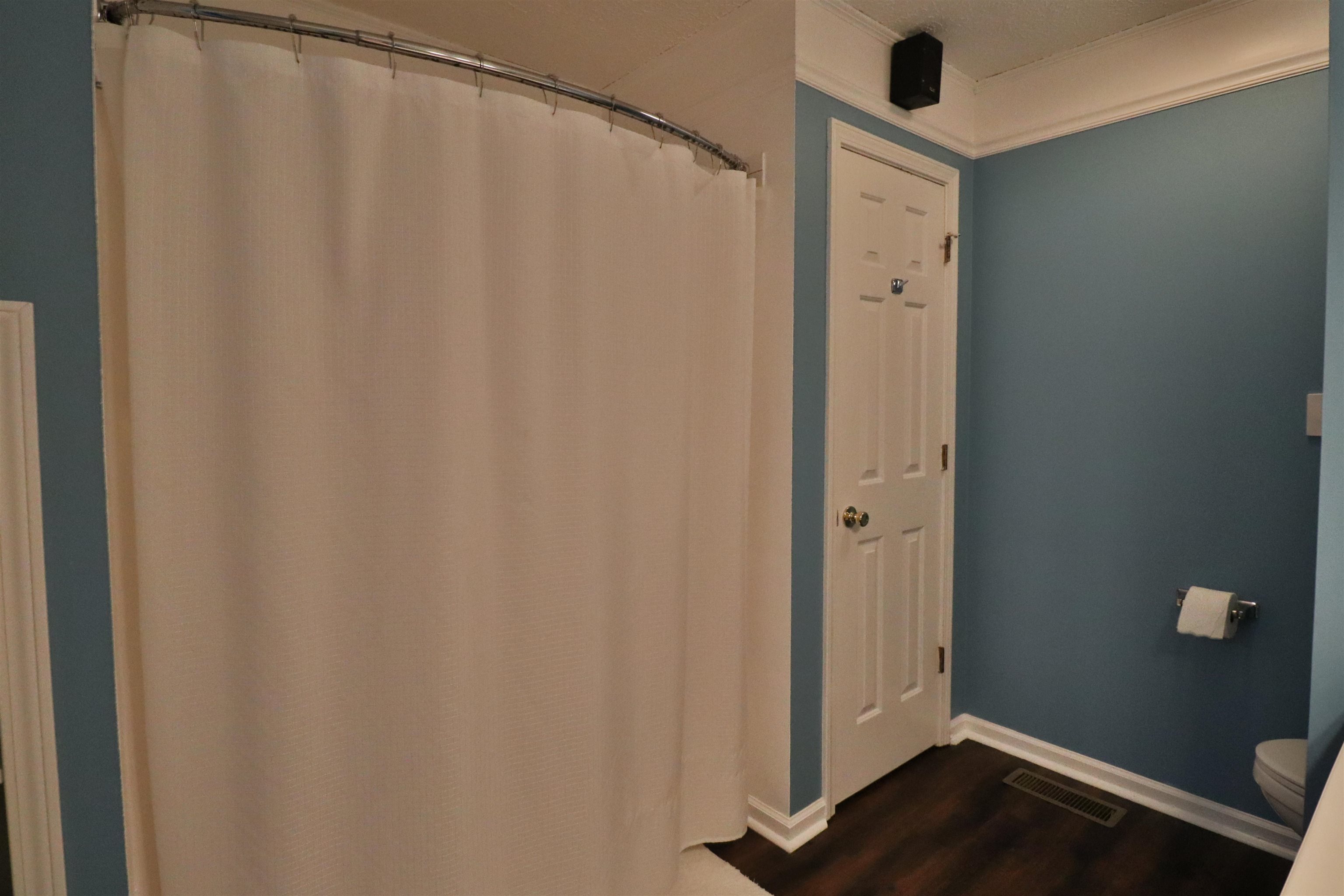 302 Ford Store Road Ripley, TN 38063 - Photo 20 of 40 a view of a bathroom with a shower curtain