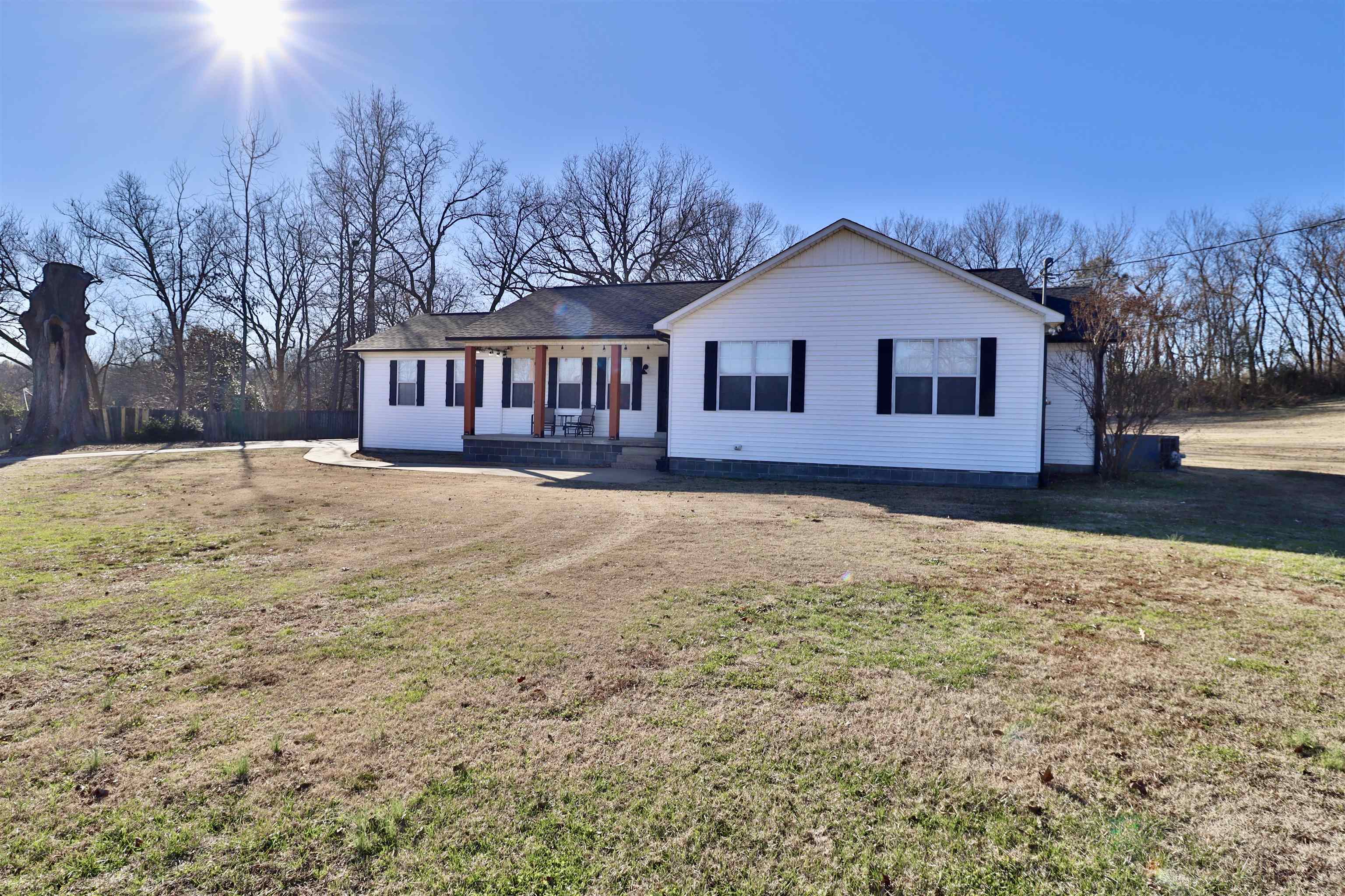 302 Ford Store Road Ripley, TN 38063 - Photo 2 of 40 a view of a house with a yard covered with snow in front of house