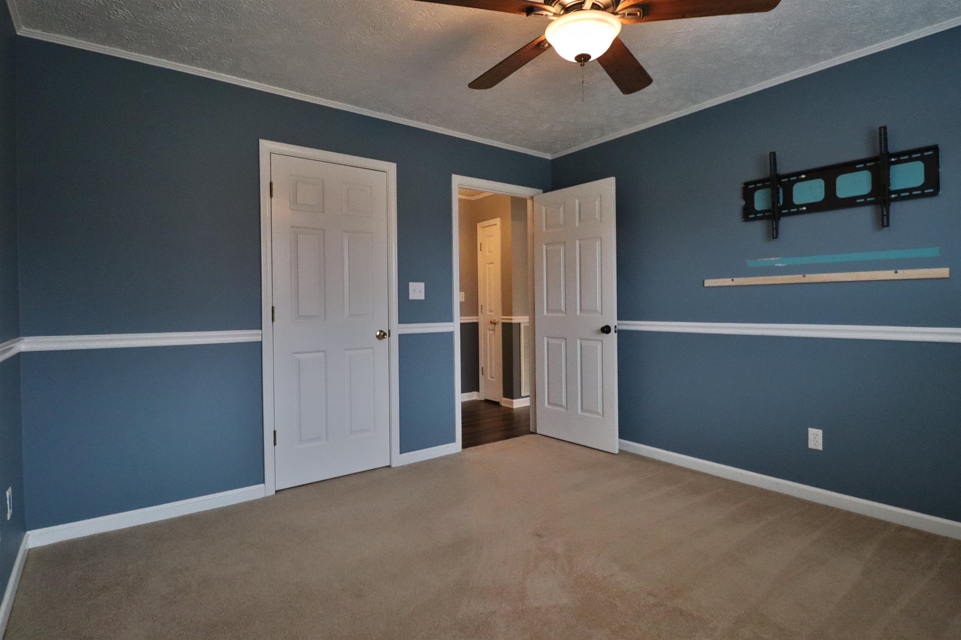 302 Ford Store Road Ripley, TN 38063 - Photo 25 of 40 a view of an empty room with a ceiling fan