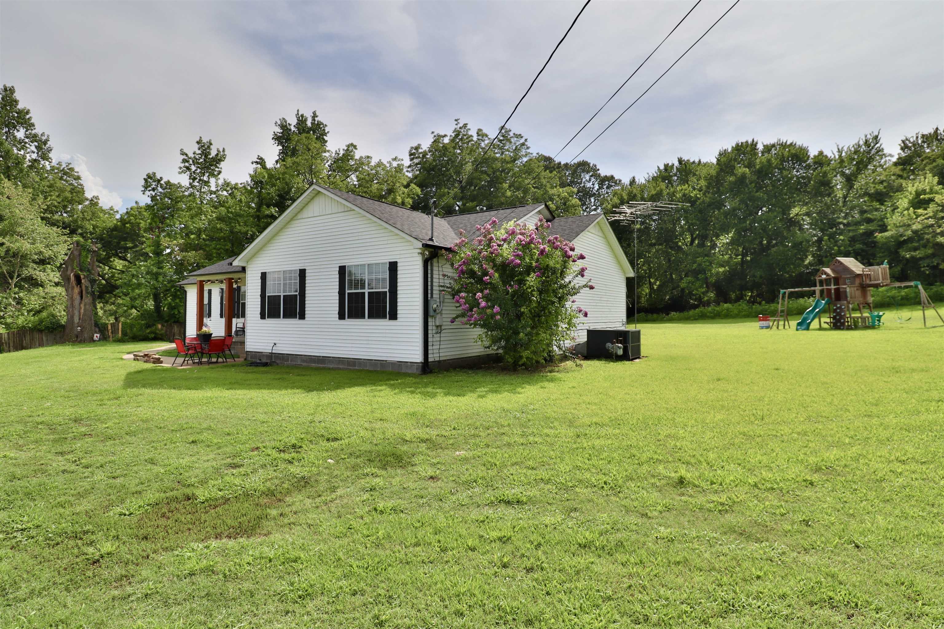 302 Ford Store Road Ripley, TN 38063 - Photo 33 of 40 a front view of a house with garden