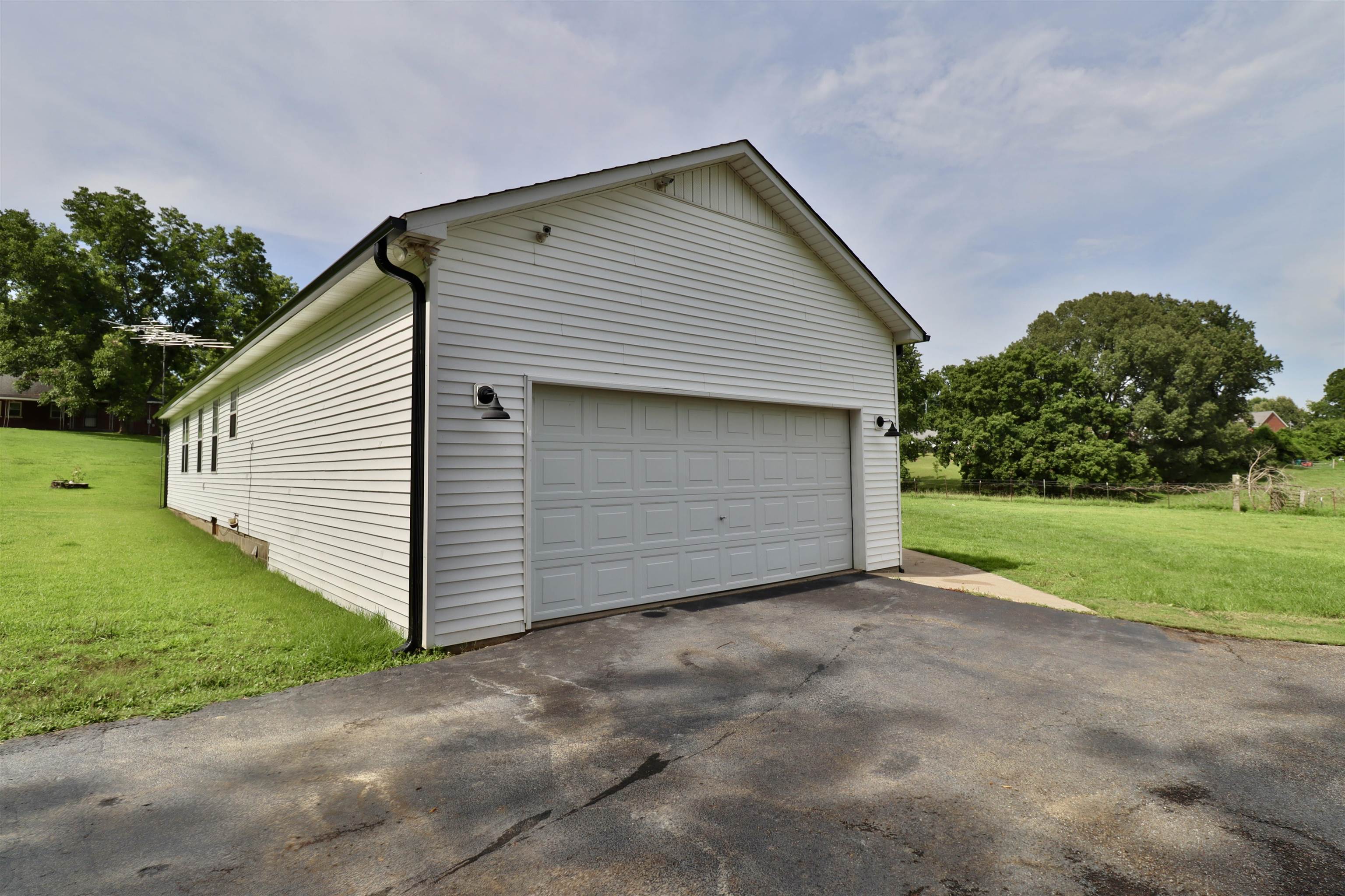 302 Ford Store Road Ripley, TN 38063 - Photo 39 of 40 a view of backyard of house and garage