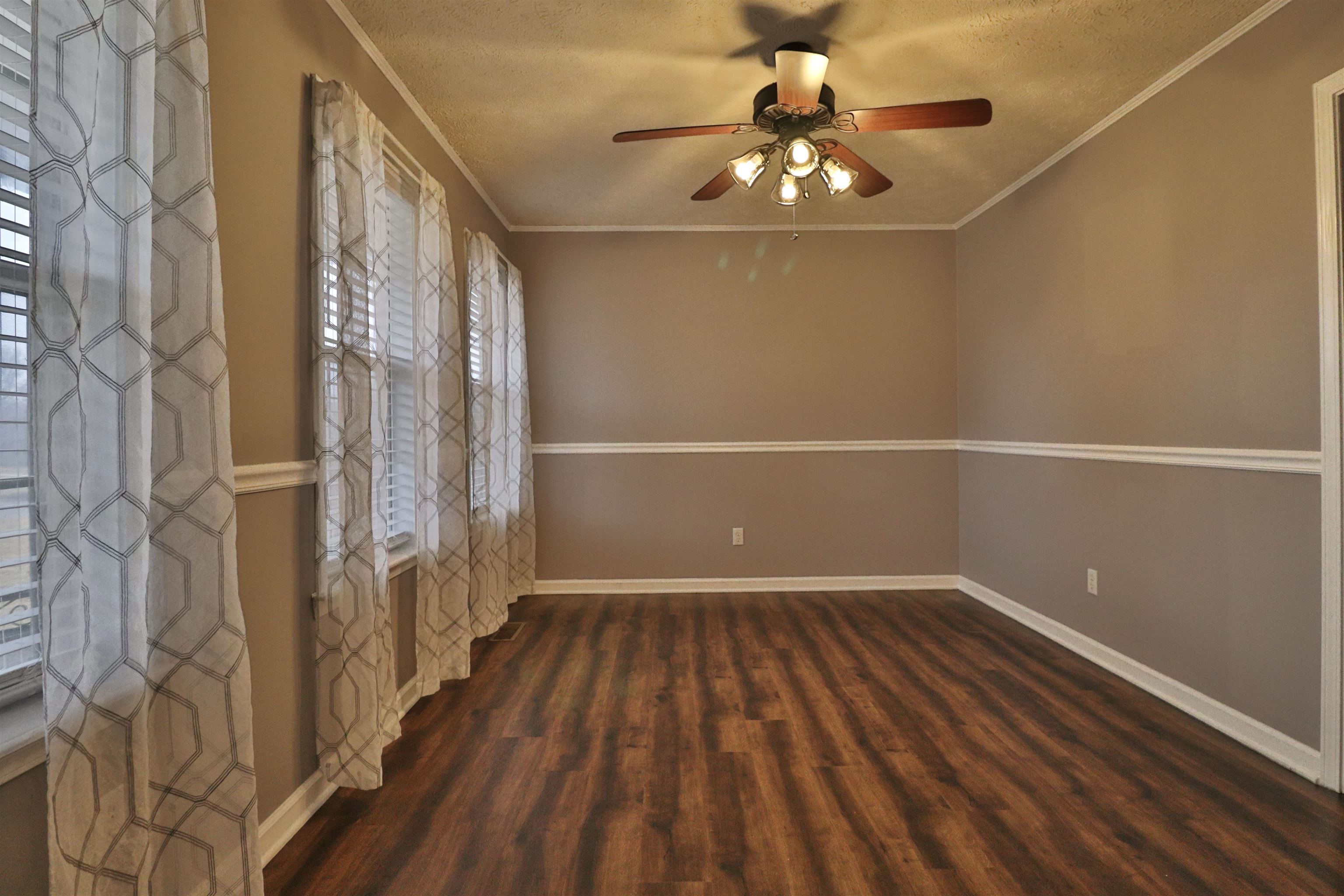 302 Ford Store Road Ripley, TN 38063 - Photo 4 of 40 a view of a room with wooden floor and fan