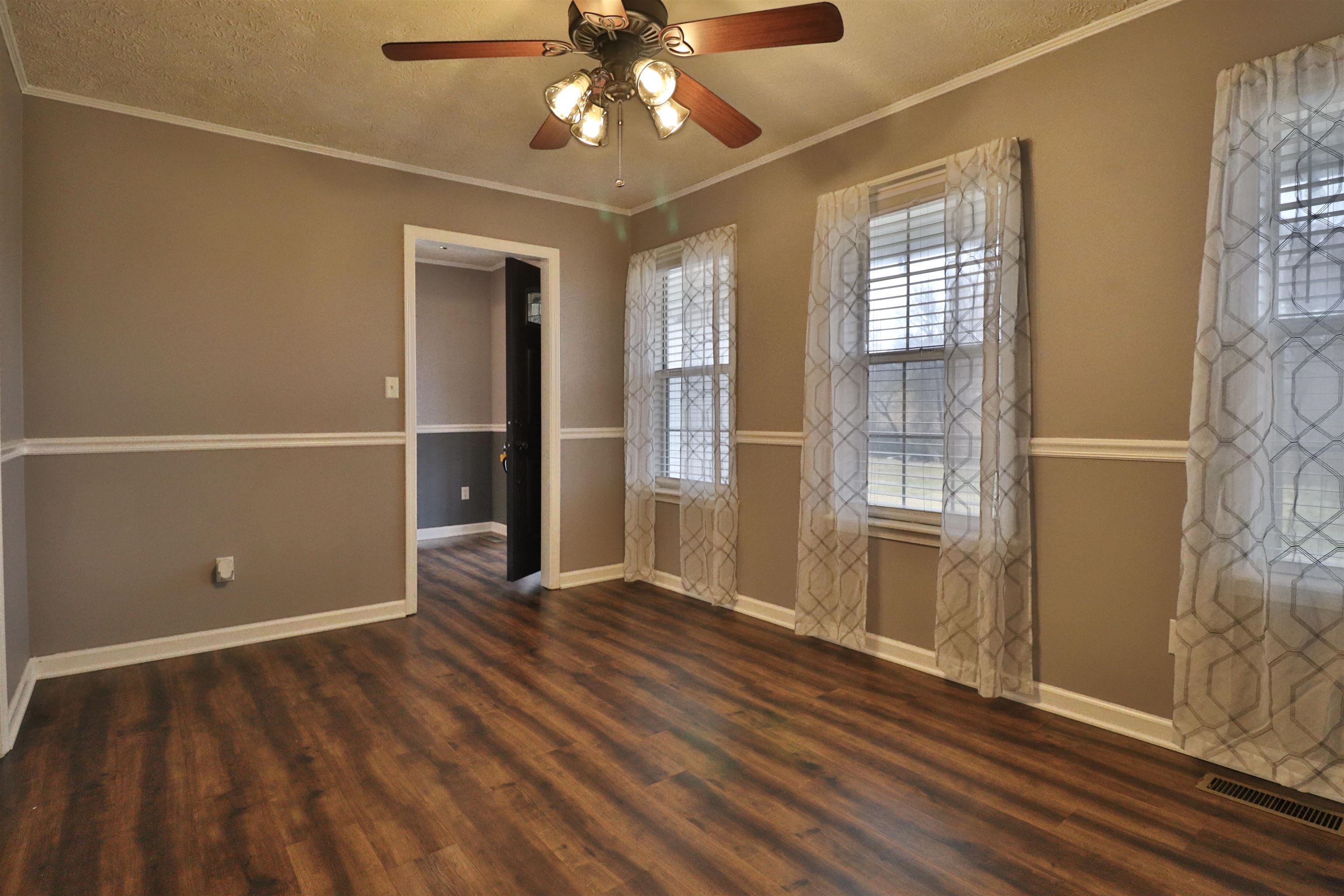 302 Ford Store Road Ripley, TN 38063 - Photo 6 of 40 an empty room with wooden floor closet and windows