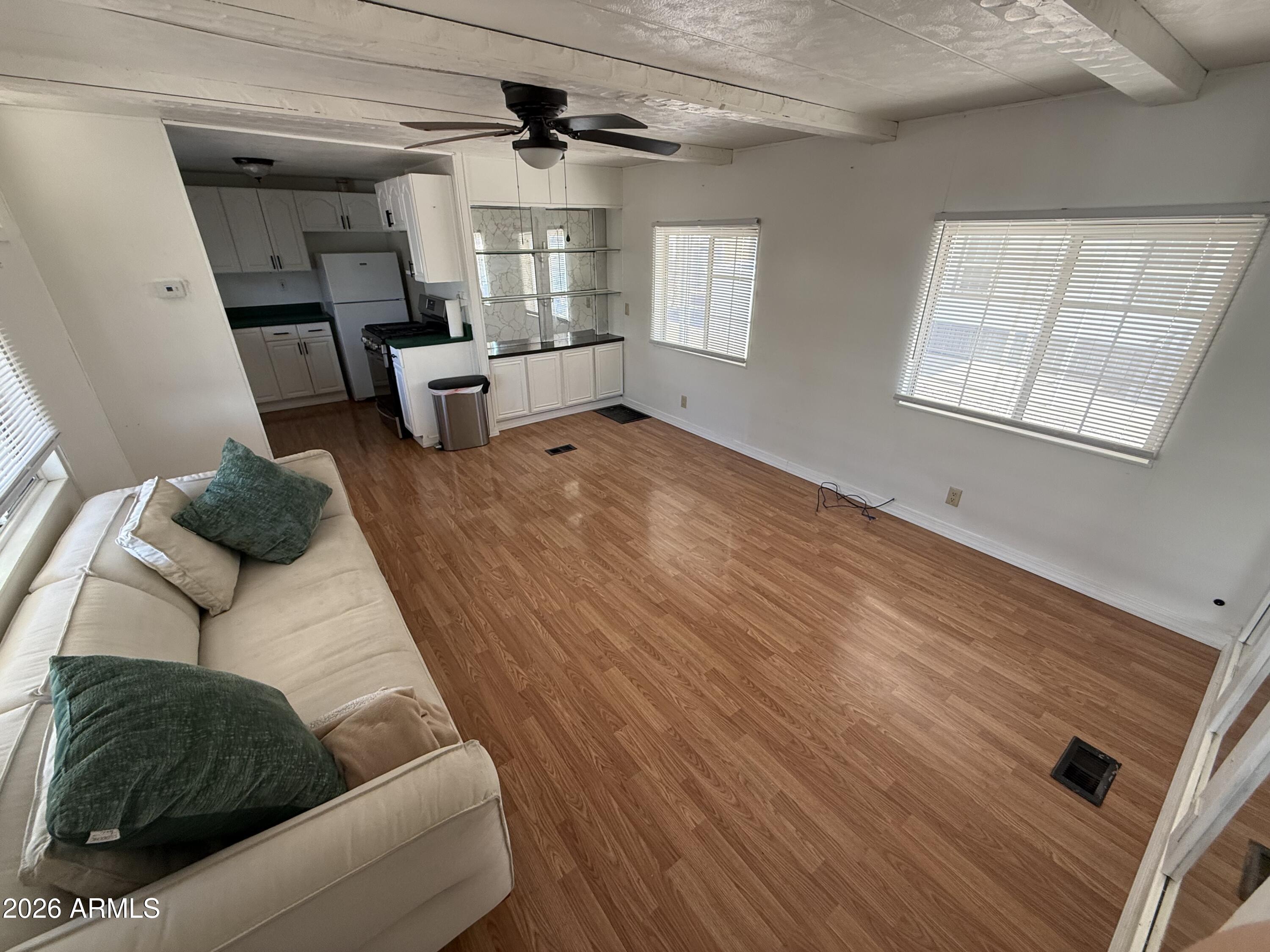 9501 East Broadway Road, Unit 48 Mesa, AZ 85208 - Photo 3 of 12 a living room with furniture and a window