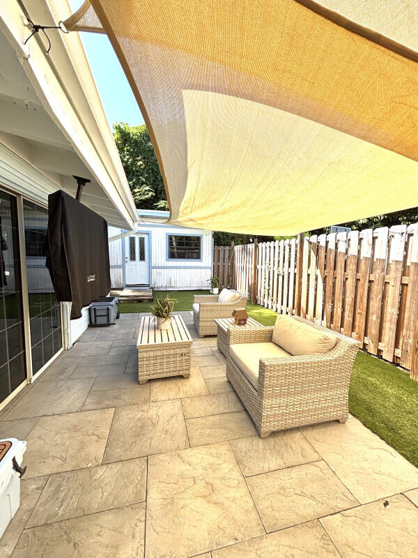 124 South Hammock Road Islamorada, FL 33036 - Photo 11 of 11 a balcony with furniture and a rug