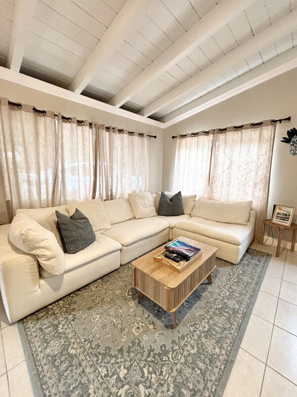 124 South Hammock Road Islamorada, FL 33036 - Photo 2 of 11 a living room with furniture and a rug