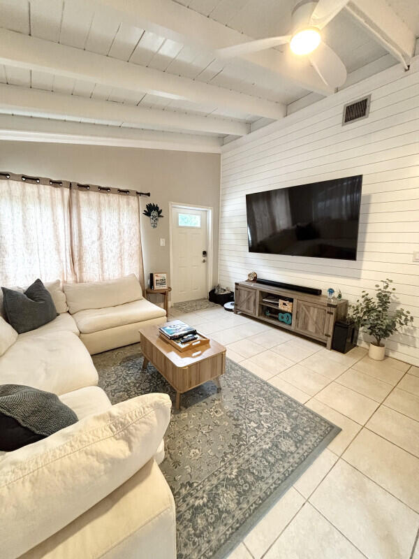 124 South Hammock Road Islamorada, FL 33036 - Photo 3 of 11 a living room with furniture and a flat screen tv