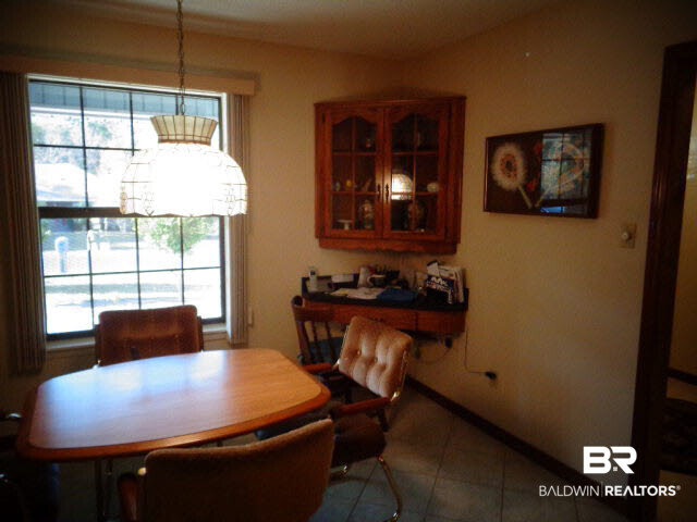 2804 Pine Ridge Drive Lillian, AL 36549 - Photo 15 of 39 13 x 12. Italian porcelain tiled floor. Custom built-in corner wood cabinets/desk. Tiffany style light fixture.