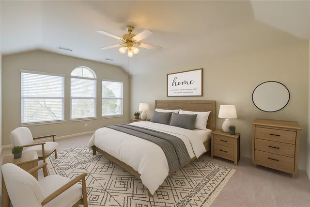 a bed room with a bed and a chandelier