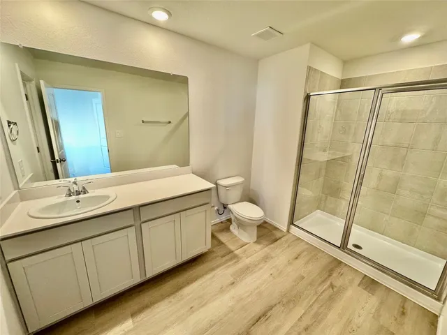 a bathroom with a double vanity sink and mirror