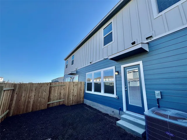 a view of a porch with wooden floor and fence